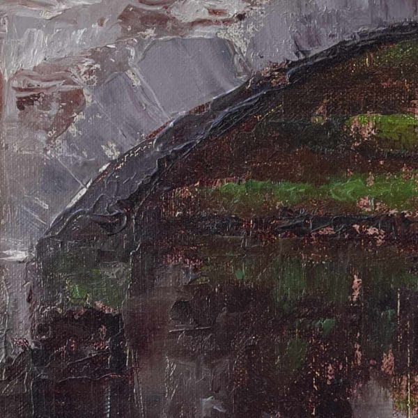 Detail of a landscape oil painting of a stone bridge over a river with autumn-colored grasses in the foreground displayed on a wall.