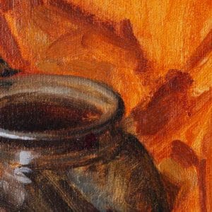 Detail of a oil painting of a black cauldron set in a background of orange and green fabric.