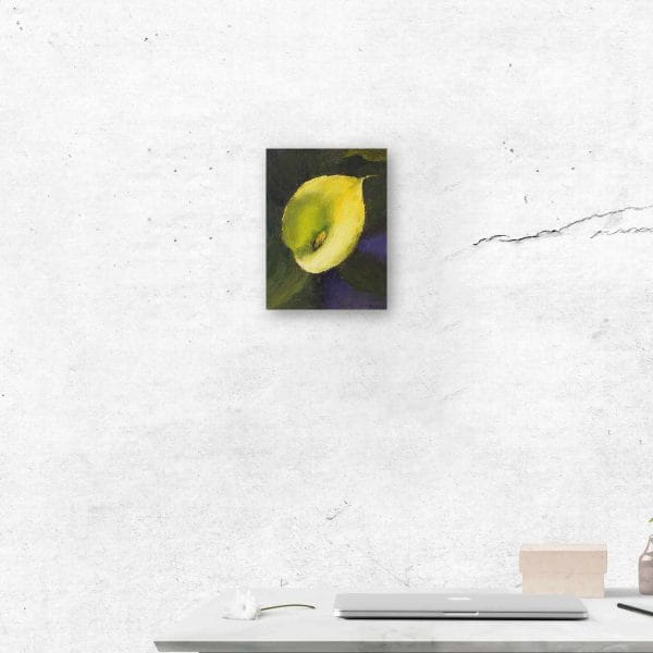 An oil painting of a yellow calla lily, placed against a warm green and dark violet background as displayed on an interior wall.