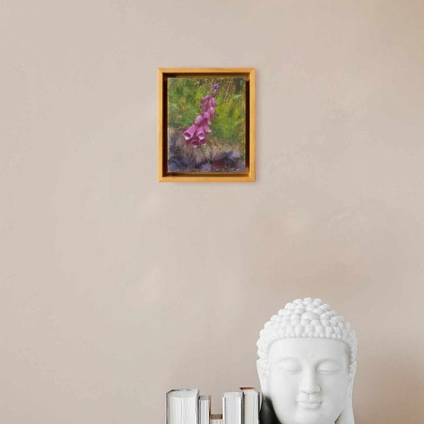 An oil painting of Foxglove, a violet colored flower, placed against a warm green background as displayed on an interior wall.