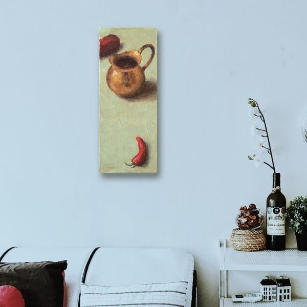 Oil painting of a copper pitcher and two red peppers set on a yellow green background in a room setting.