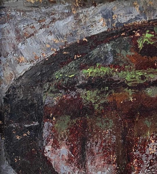 Detail of a landscape oil painting of a stone bridge over a river with autumn-colored grasses in the foreground displayed on a wall.