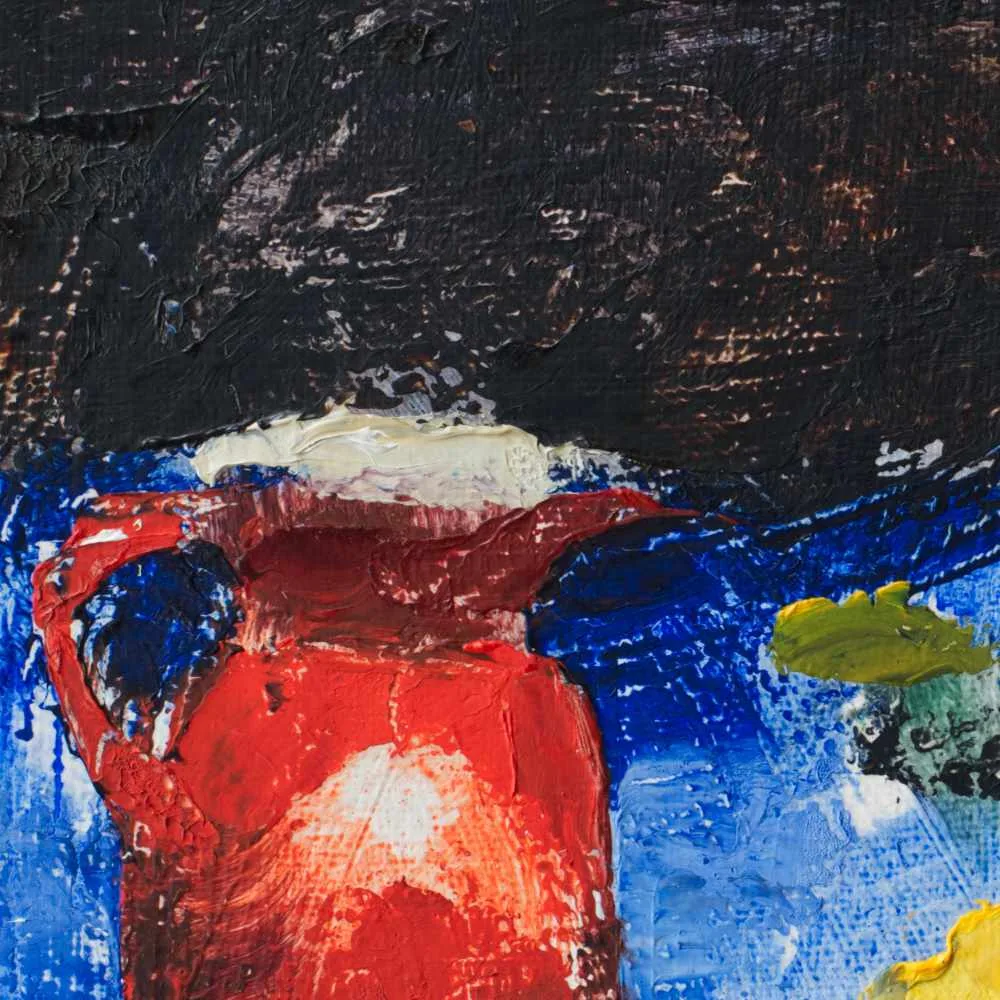 Detail of an oil painting of a red pitcher and a yellow lemon on a blue cloth with a dark fabric background.