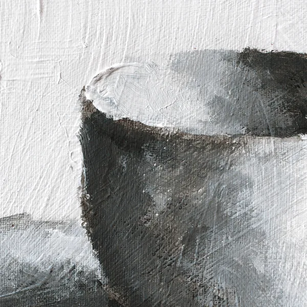 Detail of a monochromatic oil painting of a white cup on a white background with black and grey shadows.