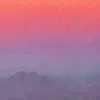 Detail of an oil painting of a full moon above the horizon and distance mountains in a vibrant, colorful sky at dusk.