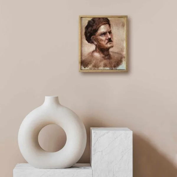 An oil painting of a local artist in monochrome who posed for a session of the weekly meetings of the Taos Society of Portrait artists as displayed on an interior wall.